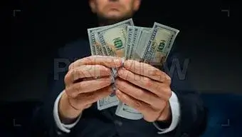 man counting us dollar bills PREVIEW 1 https://dotoman.ir/wp-content/uploads/2023/09/logo-5.jpg ادیت سریع و خلاقانه